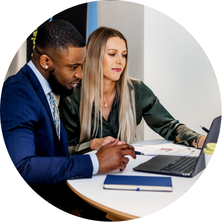 office staff using a laptop to carry out work