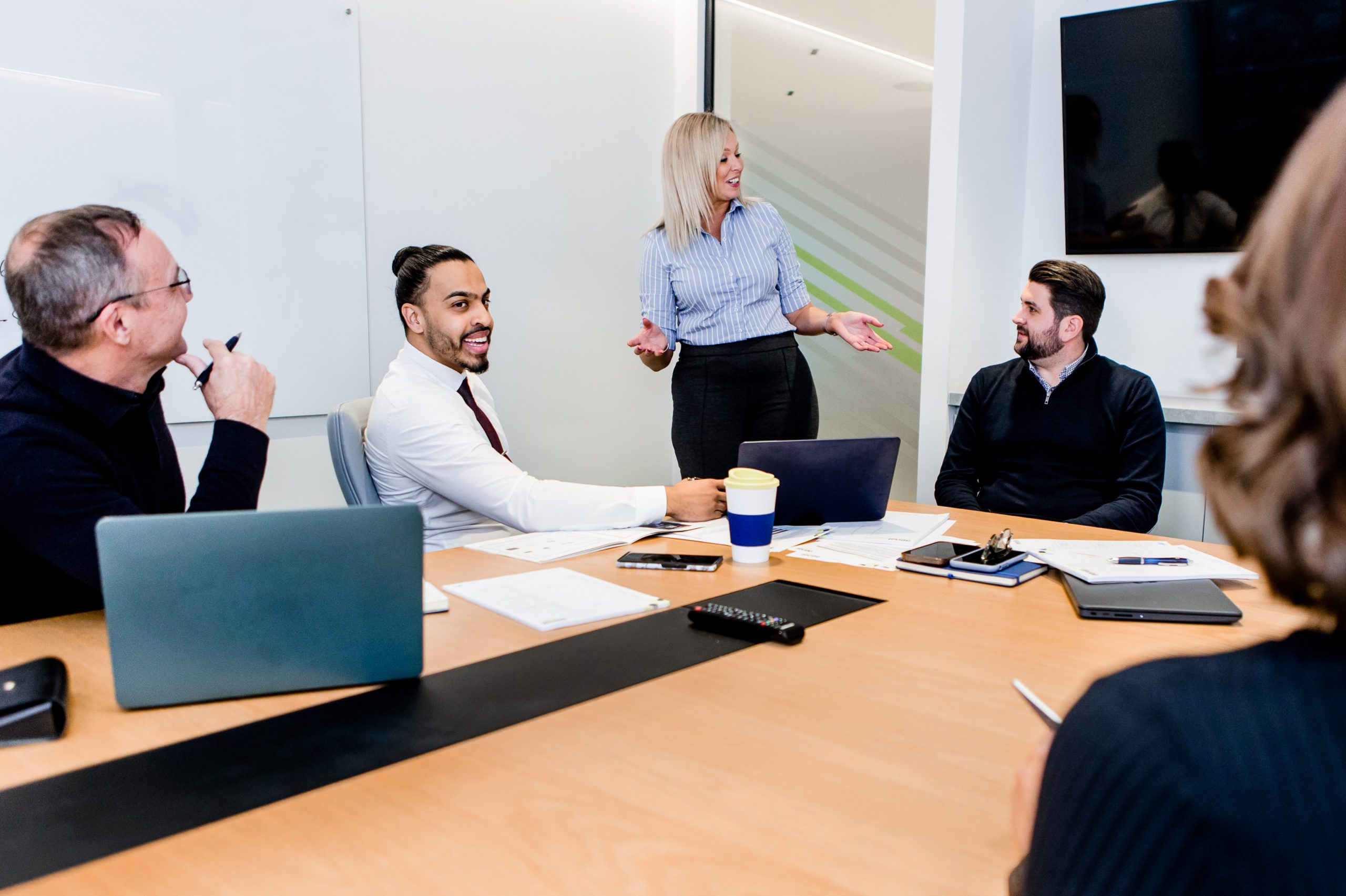 staff members in a meeting room having a conversation