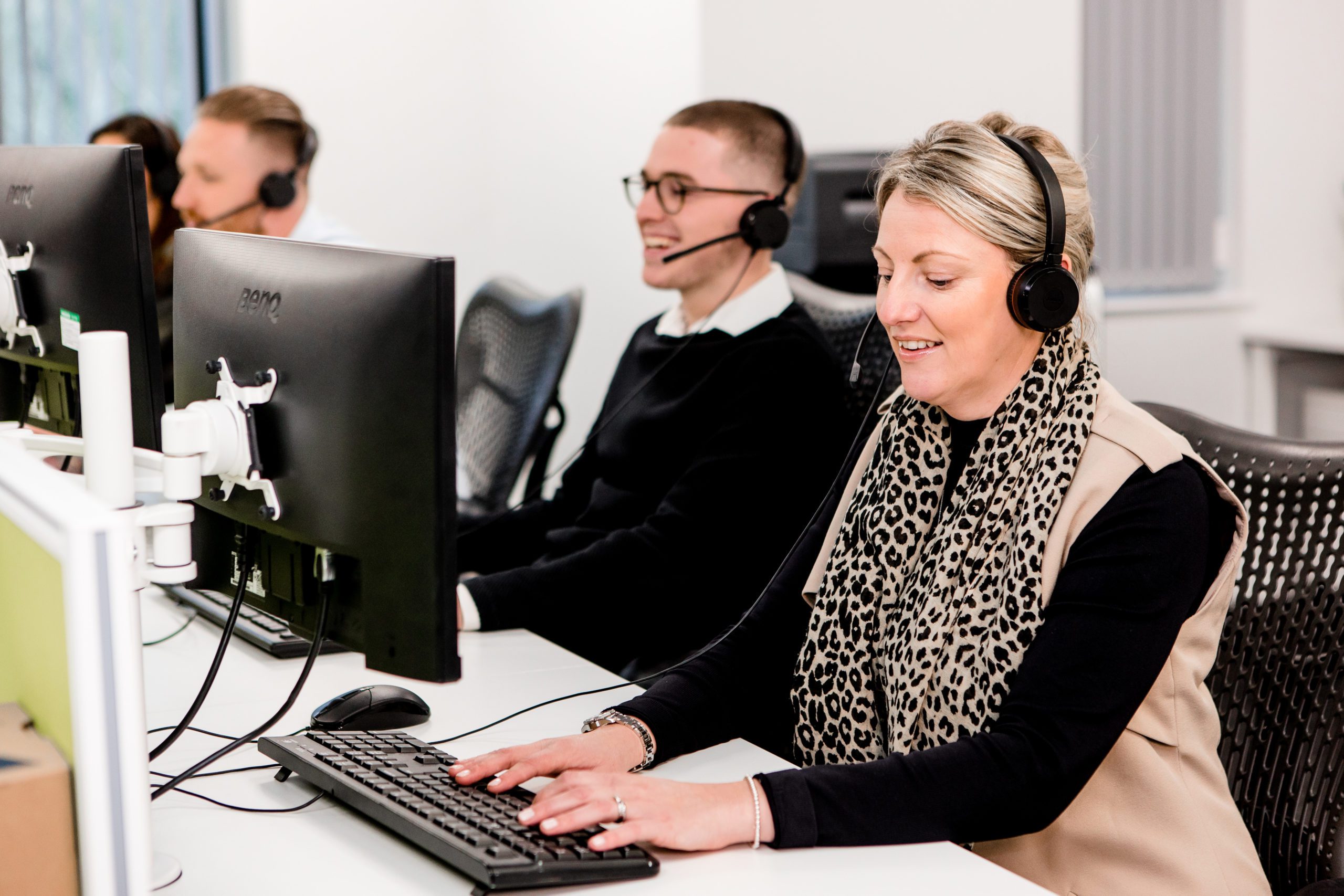 contact centre staff calling customers using headsets