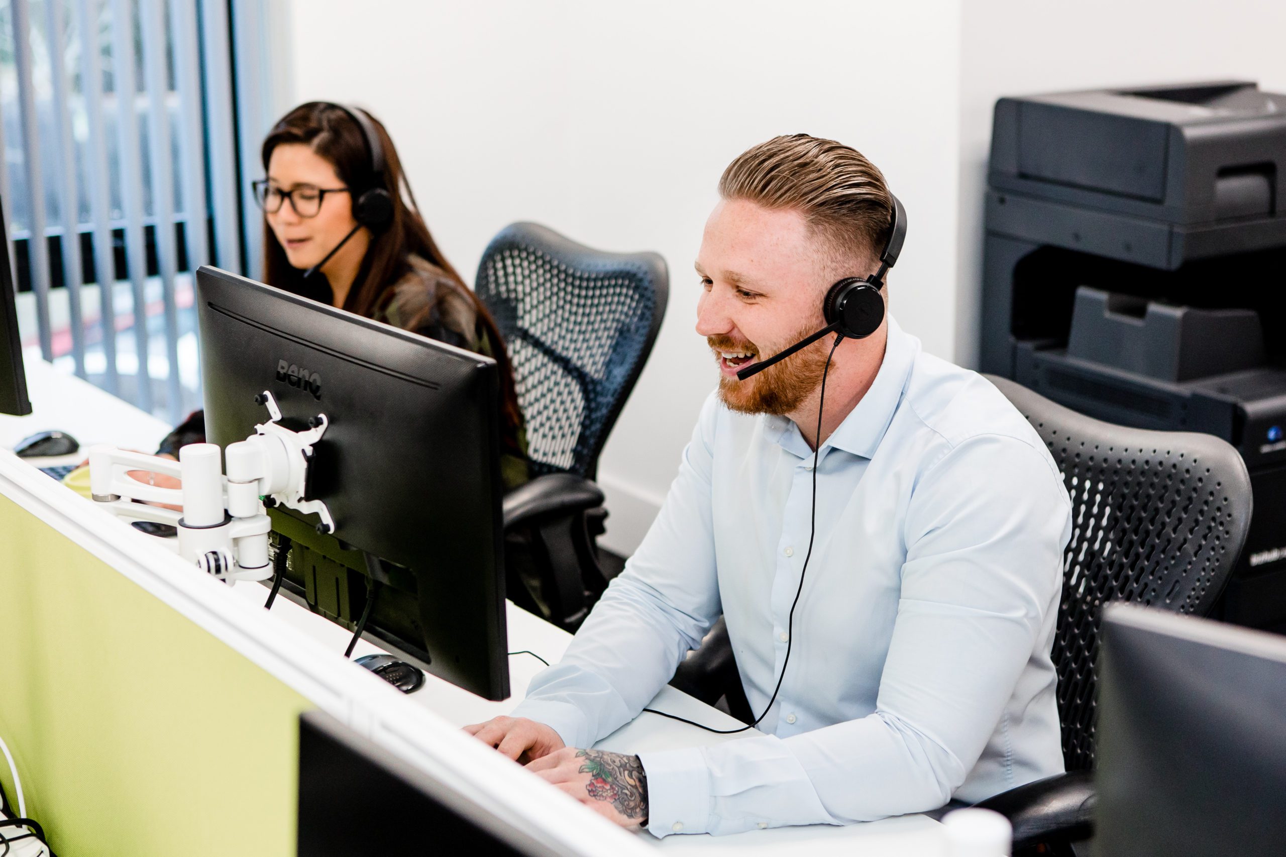 contact centre staff using headsets to phone customers